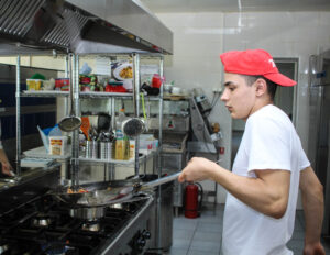 a cook in a restaurant kitchen